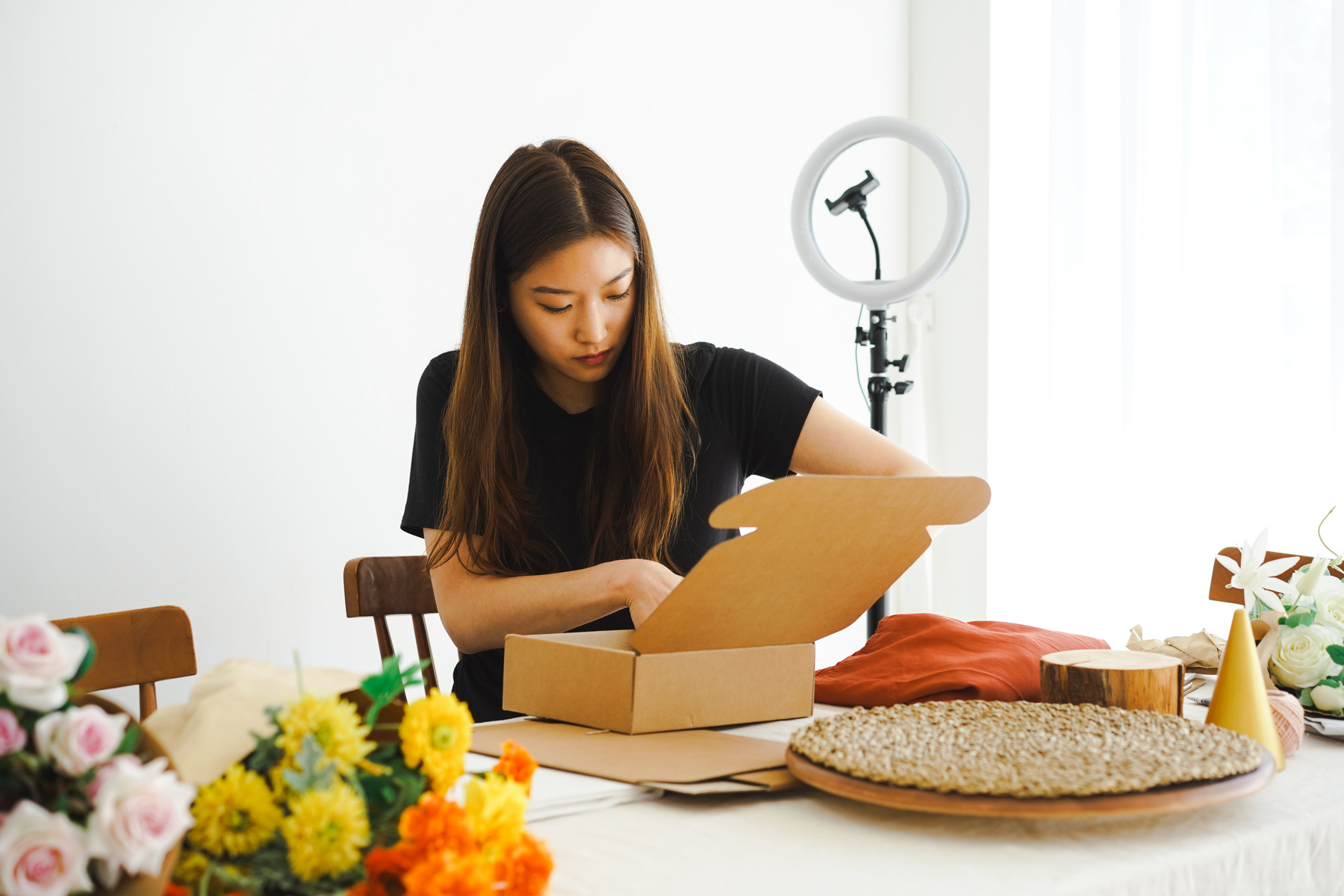 Woman Packing Orders in Cardboard Box